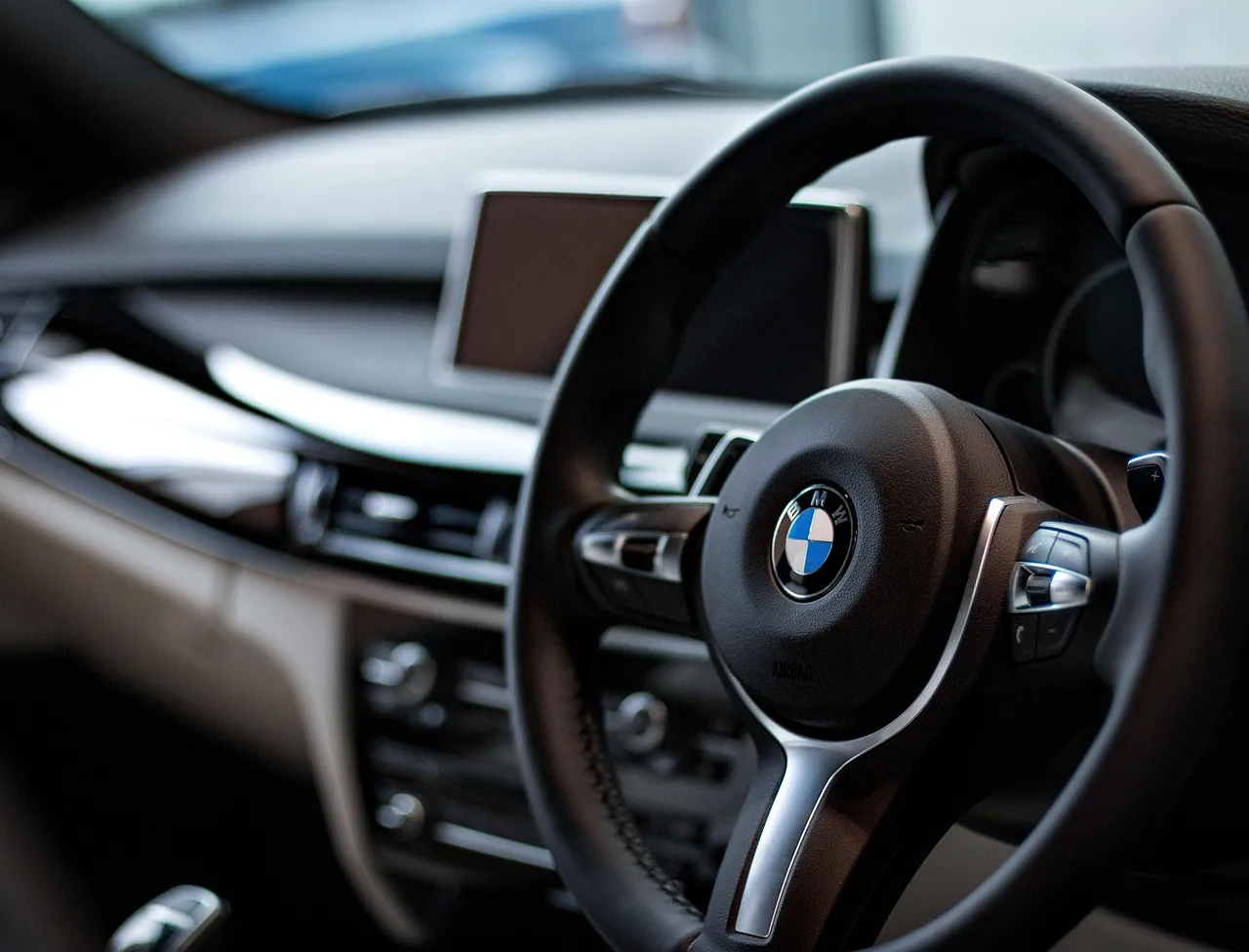 Modern car interior with a digital dashboard and steering wheel