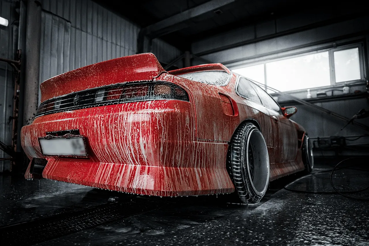 Sports car being washed in a garage
